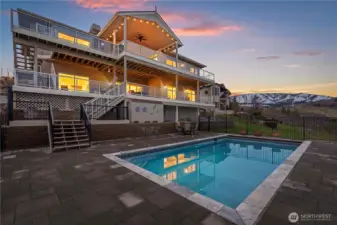 Sun, splashes, and smiles—this fully fenced patio with large pool is a playground for all ages during all times of the day & evening.