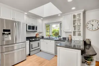 Bay window, SS appliances, gas stove, and granite countertops.