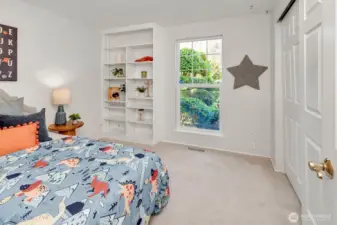 2nd bedroom with attached shelves.