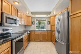 Keep an eye out to the covered patio from the sink!