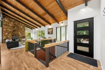 Beautiful, Open entryway with staris down to garage.