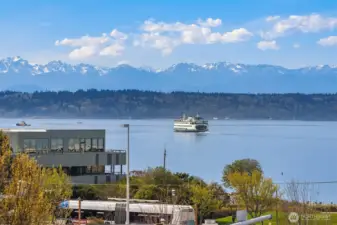 Experience luxury living in this top-floor penthouse boasting endless sound & mountain views.