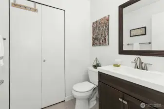 Powder bath on main, laundry behind the bi-fold door!