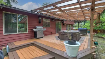 Enjoy your own personal sanctuary all year around with expansive deck, patio cover & hot tub.