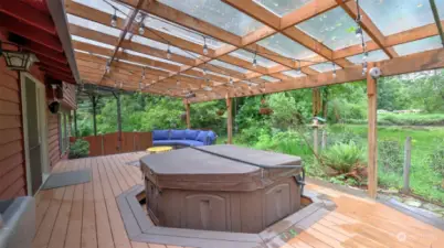 Hot tub is conveniently built into the deck.