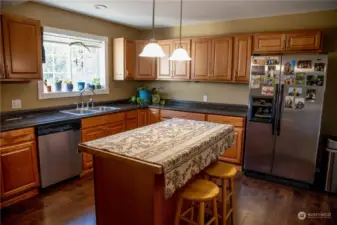 Spacious kitchen updated in 2020 with a large island and stainless-steel appliances included.