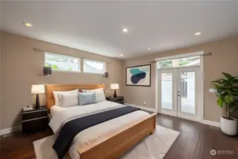 Primary bedroom with French Doors to the private deck