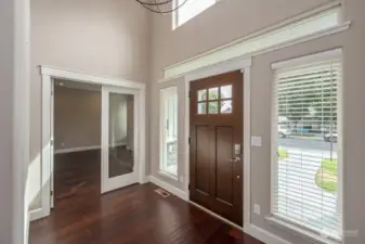 Entry Hall - Beautiful light filled entry with 16' ceilings and amazing light fixture.