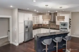 Look at the pot filler above the stove top - and the beautiful coutnertops