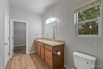 The large vanity provides ample counter space and storage.