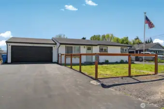 Beautiful completely remodeled home with new attached garage, new roof and siding and fully fenced yard