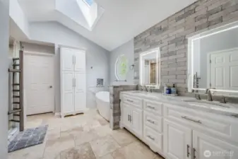 Primary suite luxury bathroom. Heated floors and towel bar. Lavish tile work