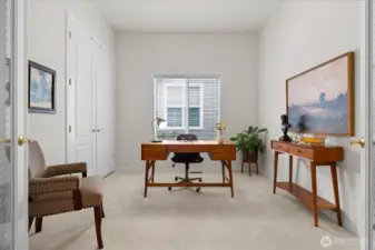 Ideal for a home office, the den with French doors and closet full of custom shelving, is thoughtfully positioned off the entry