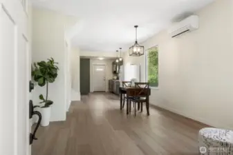 Open-concept layout seamlessly connects the living area with the kitchen & dining spaces