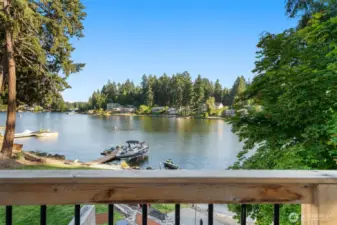 Imagine unwinding on Unit B’s balcony, where a chic mix of wood banister and black metal spindles creates a stylish barrier between you and the stunning Long Lake panorama. This spot lets you effortlessly blend indoor luxury with outdoor charm, overlooking flat lawns and private docks ready for your next adventure. Whether you’re watching the boaters glide across the water during motorized lake hours or hosting friends on the huge concrete patio just below, this balcony is your VIP pass to the best of waterfront living.