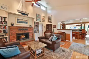 High windows flood the living room with natural light.