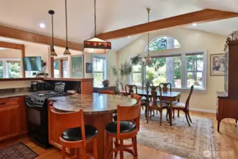 The kitchen opens into the dining area and living areas