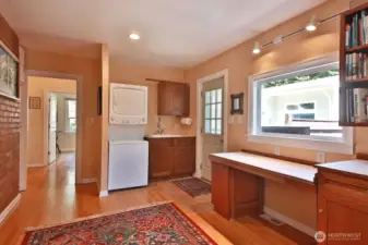 A stacking laundry unit and large utility sink finish off the laundry/mud room.