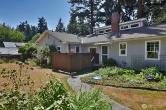 Photo of the back of the house from the shop.