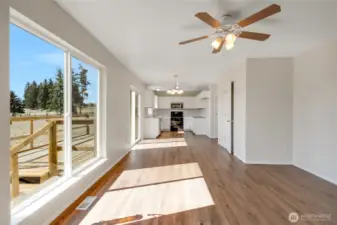 Looking towards kitchen from family room with deck off slider