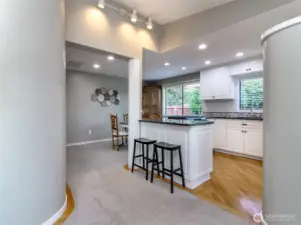 Rounded walls & Open concept kitchen with eat in space.