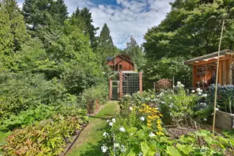 Expansive deer fenced vegetable and flower garden located on the south side of your home.