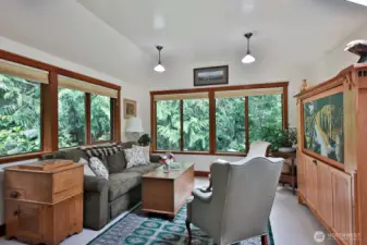 Lots of windows and skylights bring in plenty of light to the Family Room. This part of the home (north side) has you close to the cedars and firs keeping your connection to nature.