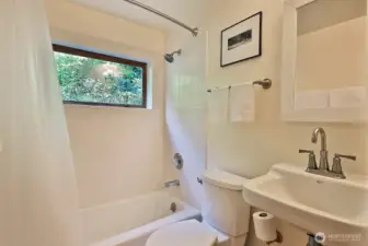 This full bath is located in the hallway between the Kitchen/Dining area and the Family Room. We are now going back to the south/east side of your home, to the mud/laundry room in the next photo.