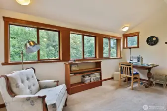 This is the office, currently used as a sewing room. This room looks out upon the eastern side of your home.