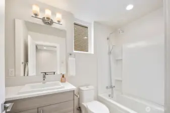 Large guest bathroom next to the 3rd bedroom on the upper level.  Bathroom has natural light complete with extra storage and a full tub.