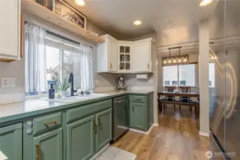 Kitchen window conveniently overlooks the backyard