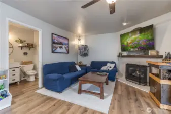 Family room connects to half bath/laundry room