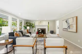 Large Living Room with Fireplace and Oversized Windows in Forest Park Everett Home