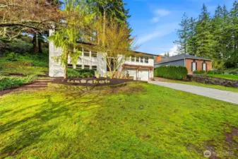 Front Exterior of Updated Forest Park Everett Home with Attached Garage and Fresh Landscaping
