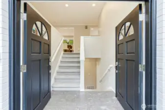 Welcoming Split Level Entry with Double Doors and Open Staircase