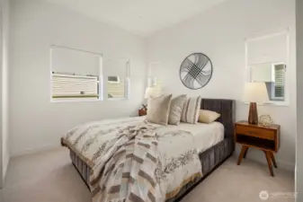 The Primary bedroom boasts brand new carpet and custom blinds.