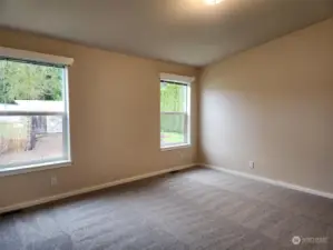 Vaulted ceiling and big windows in Primary room.