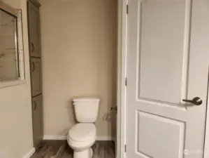 linen storage and closet in Primary bathroom.