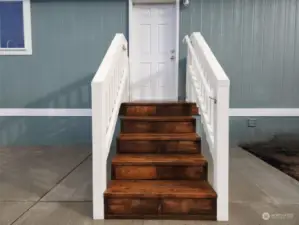 Steps from parking space leading to laundry room.