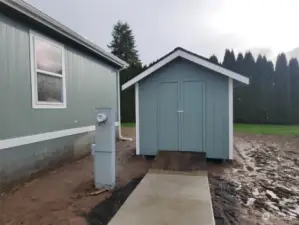 paved walkway to storage building.