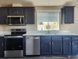 Corian counters, SS sink, and soft closing cabinets.