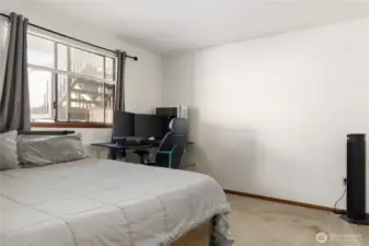 Biggest bedroom is spacious with room for dressers and desks