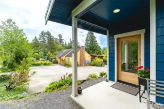 Front door with view of common house and parking