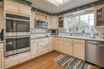 The kitchen has double ovens, microwave, dishwasher.