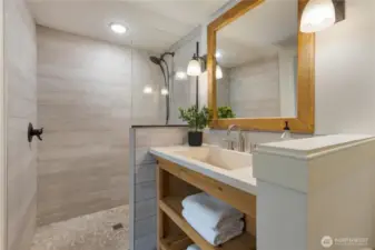 Bathroom on main floor and attached to the bonus room with Murphy bed and desk.
