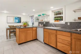 This open-concept layout connects kitchen and dining seamlessly, creating a welcoming space for gatherings or independent living.