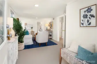 This secondary living area welcomes you with fresh finishes, bright windows, and space for both lounging and entertaining.