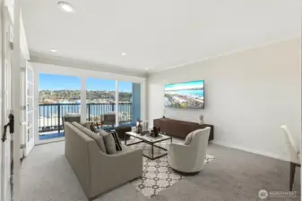 Wall of windows fills the space with natural light and panoramic lakefront views.