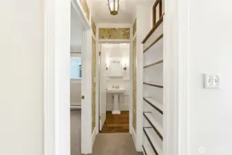Thoughtful built-ins and charming lighting enhance this inviting hallway.