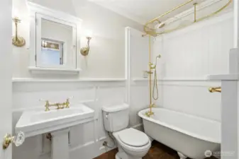 Classic clawfoot tub adds charm to this light-filled, vintage-inspired bath.